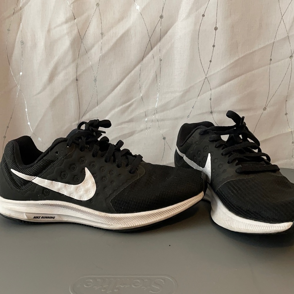 Black and white Nike downshifter running shoes